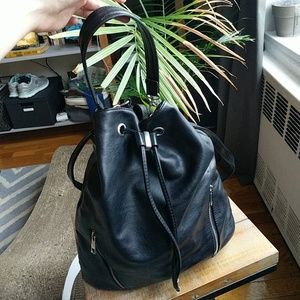 Black bucket bag with silver zipper accents